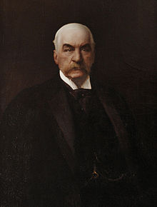 John Pierpont Morgan (17 de abril de 1837 - 31 de marzo de 1913) fue un empresario, banquero y coleccionista de arte estadounidense que dominó las finanzas corporativas y la consolidación industrial de su época. Retrato por Carlos Baca-Flor.